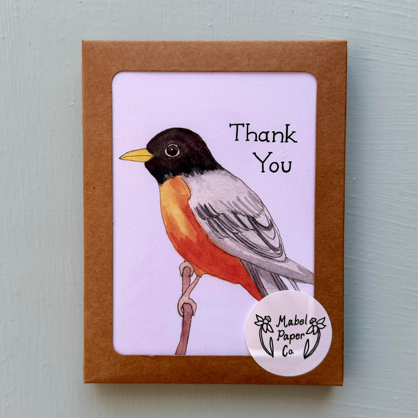 Card with a bird illustration and 'Thank You' text on a light gray background