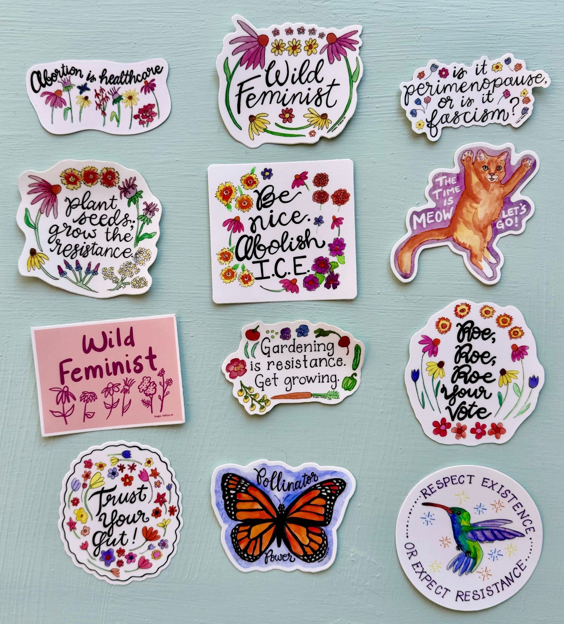 Collection of colorful stickers with various designs and text.